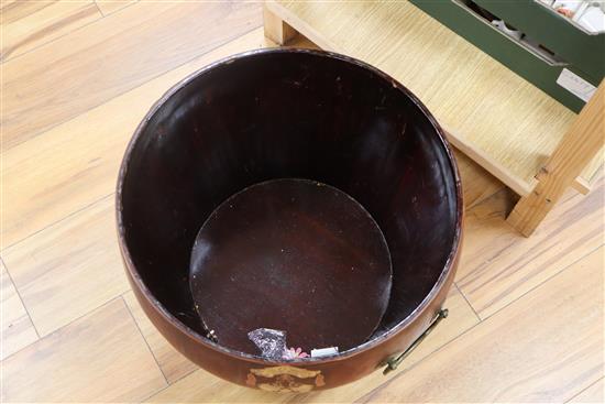 A Chinese red and black lacquer barrel shaped container